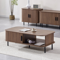 Table basse moderne en bois MDF Panneau de particules Table basse avec pieds en métal Table basse avec portes coulissantes Rangement