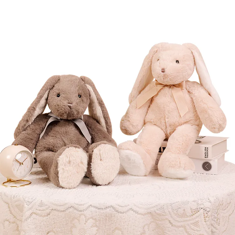 Nuovo stile di buona qualità adorabile peluche coniglietto bambola di peluche simpatico coniglio con fiocco in loop per bambini