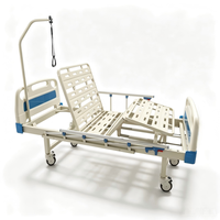 Lit d'hôpital manuel multifonctionnel avec table de lit et barre de maintien pour patients orthopédiques
