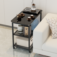 Table d'appoint multifonctionnelle mobile pour la préparation du thé avec plateau noir, structure en métal moderne, idéale pour les petits espaces