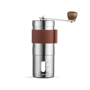 compact and portable coffee grinder with visible powder bin and black porcelain movement