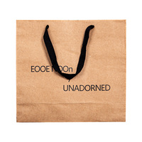 Sacs en papier kraft brun en gros avec logo personnalisé et poignée en ruban pour l'emballage de vêtements, de cadeaux et de vente au détail