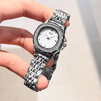 GEDI 61013 Montre-bracelet à quartz pour femme avec cadran en nacre en acier inoxydable étanche Cadeau de luxe MOP Montres pour femme