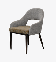Fauteuil contemporain rembourré à accoudoirs courbes avec dossier ajouré en tissu, idéal pour hôtels, espaces extérieurs et hôpitaux, résistant à l'eau
