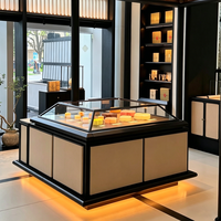 Edgy Luxe Cosmetics Boutique Featuring Tiered Open Shelves, Partial Enclosure Checkout, and Integrated LED Display Shelves