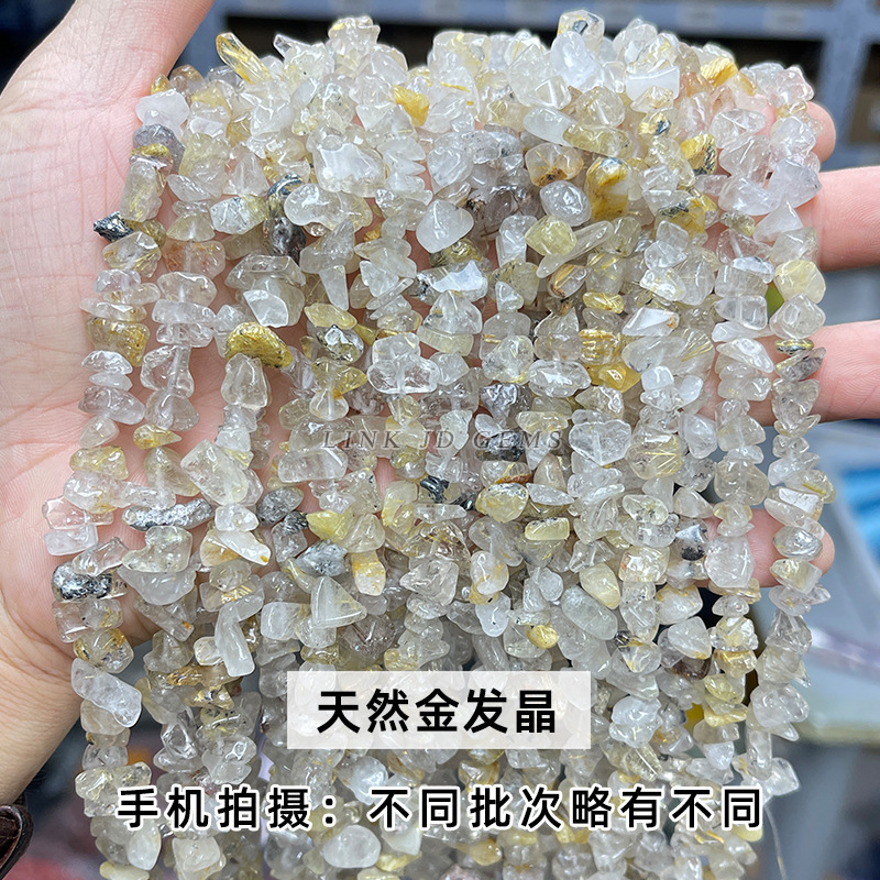 Cristalli di quarzo rutilati dorati naturali