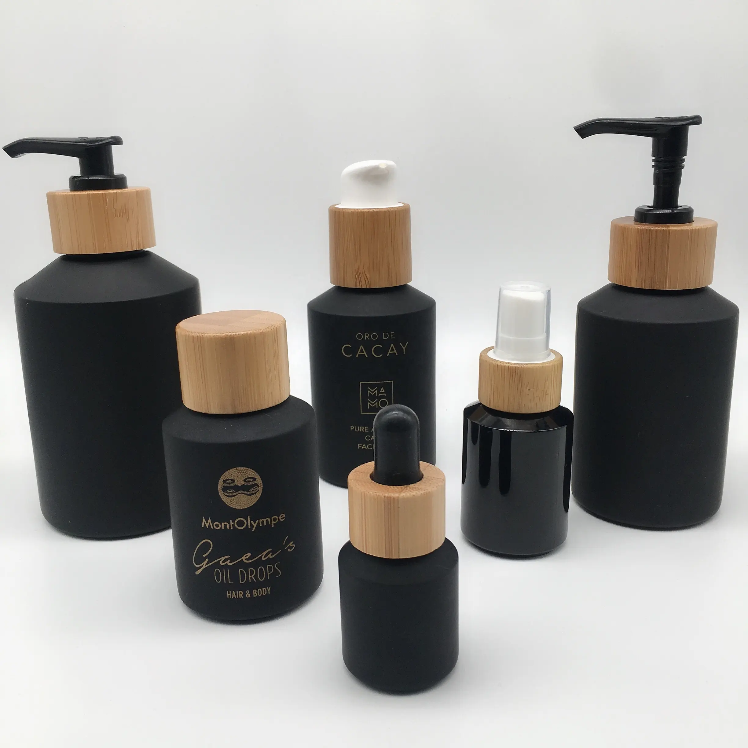 Cosmetic bottle and jar set packaging matte black slant shoulder glass bottle and jar with bamboo lid factory directly provide
