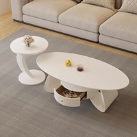 Table basse ovale en marbre style crème avec structure en métal pour salon, petit appartement, mobilier de salon simple et moderne