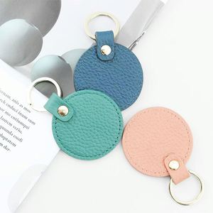 Porte-clés rond en cuir personnalisé avec logo, durable, pour voiture et sac – Meilleure vente - Product Image 1