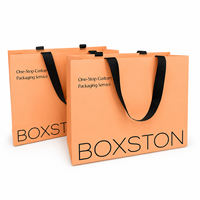 Sacs shopping en papier de luxe avec logo personnalisé et poignées pour l'emballage de vêtements, sacs cadeaux en gros