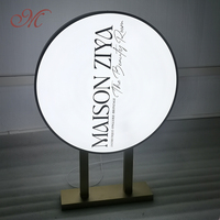 Boîte d'éclairage à LED en acrylique double face personnalisée cadre circulaire en métal pour la publicité commerciale extérieure populaire dans les magasins