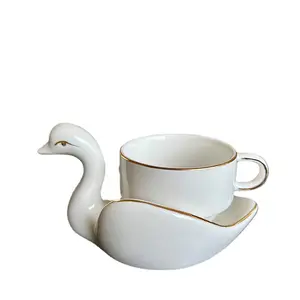 Taza y platillo de cerámica de cisne blanco, taza de café y platillo de lujo con borde dorado claro