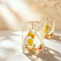 Nouvel ensemble de 12 jouets souple en forme de poire en cristal translucide, rempli de fruits, à rebond lent, jouet à presser, présenté en boîte de présentation