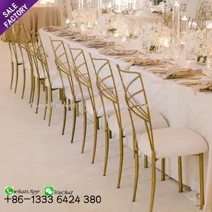 Vente en gros de meubles Foshan chaises de banquet à dossier croisé en or de luxe bon marché en métal pour mariages et événements