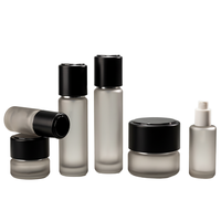Vente en gros d'ensembles d'emballages en verre personnalisés, flacon en forme de bouteille de lait, flacon en verre cylindrique de 50 ml, pompe à lotion, flacon d'huile essentielle