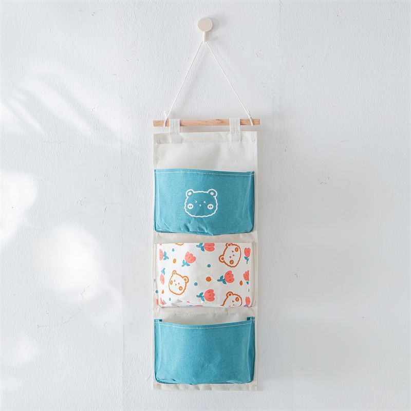 Bolsa colgante azul de tres bolsillos