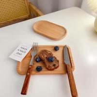 Plateau ovale en bois massif servant le dessert tasse tapis fromage gâteau assiette bijoux clé pièce caboteur fleur plante vaisselle décorative