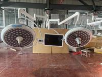 Haute qualité double bras plafond médical lampe sans ombre chirurgie lampe d'opération Ot lumière avec écran d'affichage de caméra