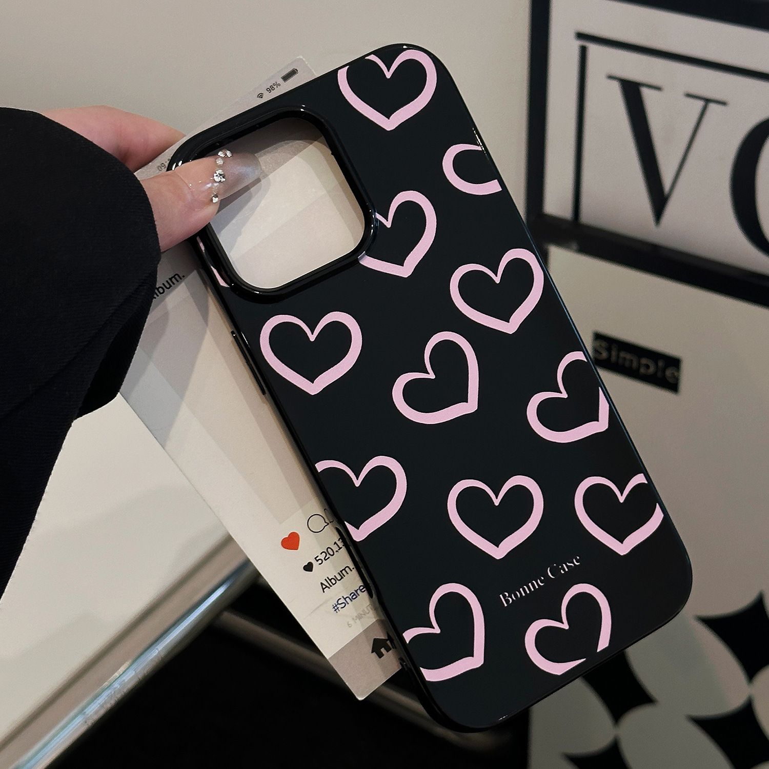 Glossy black with hollow pink hearts