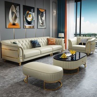 Ensemble de canapés capitonnés en cuir véritable avec ottoman, fauteuil et pieds en métal doré, matelassé, luxe bleu-orange pour salon et villa