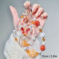 Breloque de téléphone en strass et perles, motif papillon orange et étoile, pendentif de sac artisanal, cordon de poignet, cadeau bijou pour femme