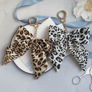 Autumn and Winter Leopard Print Bow Keychain Korean Style Fabric & Metal Ribbon Bag Pendant Creative <b>Car</b> - Product Image 1