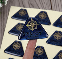 Autocollants 3D en époxy personnalisés avec logo boussole triangulaire, autocollants décoratifs imperméables de la marque Spintoy