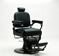 Fauteuil de barbier vintage en cuir cousu avec cadre noir mat, fauteuil de salon hydraulique pour usage professionnel en salon de coiffure