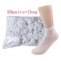 Chaussettes jetables non tissées avec poignée antidérapante Chaussettes à usage unique pour services de location 50 paires/sac Chaussettes couvre-pieds