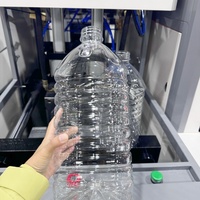 Bon prix Machine de soufflage de bouteilles en plastique semi-automatique à 2 cavités de 5 litres S'applique à la bouteille d'eau de 3 litres 4 litres 5 litres Bouteille d'huile