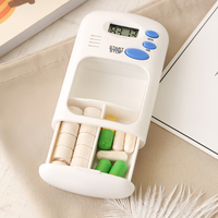 Organisateur de pilules intelligent portable de haute qualité avec boîte de rangement en plastique, fonctions de rappel et de minuterie d'alarme