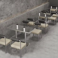 Combinaison moderne industrielle de table et chaises en acier inoxydable pour salon, restaurant, café, idéale pour les salons de thé et les espaces commerciaux.