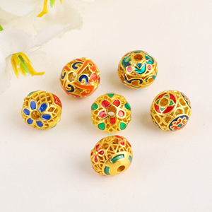 Cuentas redondas tradicionales de esmalte dorado de 10 mm con efecto de goteo de aceite, huecas, accesorios de joyería para pulseras y collares DIY - Product Image 1
