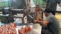 Machine d'emballage du miel pour un conditionnement efficace du miel, du sirop, des édulcorants liquides et d'autres produits liquides visqueux