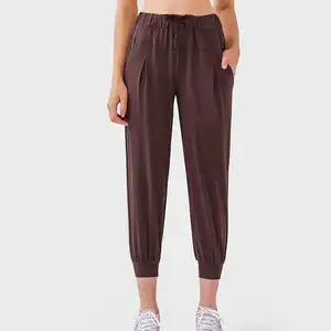 Vente en gros de joggings de sport fuselés, pantalons amples d'entraînement de course athlétique pour femmes, joggeurs avec poches