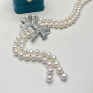 สร้อยคอประดับมุกน้ำจืดทรงยาวประดับโบว์และโซ่เสื้อสเวตเตอร์ สร้อยคอมุกสุดหรู - Product Image 3