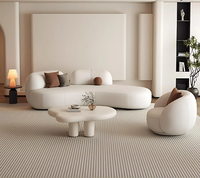 Canapé modulaire incurvé de luxe en cuir PU crème, style moderne et minimaliste, avec coussins ronds, pour salon, centre commercial et hôtel