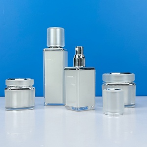 High Quality Black White Lotion <b>Pump</b> Cosmetic <b>Bottles</b> and Jars with Gold Cap Lip - Product Image 1