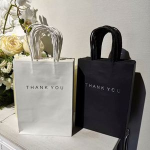 ถุงกระดาษคราฟท์รีไซเคิลสีขาวน้ำตาลพิมพ์ลายขอบคุณแบบออฟเซ็ตตามสั่ง พร้อมหูหิ้ว ขายส่ง มีตัวเลือกพิมพ์โลโก้ตามสั่ง - Product Image 3