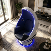 Fauteuil lounge individuel en fibre de verre en forme de vaisseau spatial incurvé avec bande lumineuse LED bleue et coussin en cuir noir pour coin détente à domicile