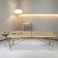 Table de massage pliable en acier inoxydable de haute qualité, moderne et portable, pour spa, salon de beauté, soins des cils et du visage
