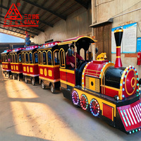 Train électrique tout-terrain adaptatif en acier sans rails pour parcs d'attractions et centres commerciaux, idéal pour les visites en extérieur