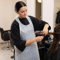Tablier jetable imperméable sans manches en gros pour le secteur médical, la cuisine, les salons de coiffure, la peinture et l'industrie alimentaire