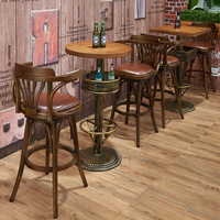 Ensemble de table et de chaises de bar en bois massif de style américain vintage avec accoudoirs pivotants et dossier, chaise de bar haute pour usage commercial