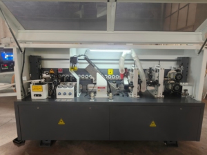 เครื่องปิดขอบไม้แบบอัตโนมัติ JUNDE รุ่น High Productivity 380V 6500W สำหรับงานตัดแต่งประตูไม้และตู้ไม้ - Product Image 6