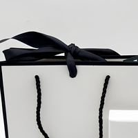Sac de courses pliable en papier d'art biodégradable de luxe, avec logo personnalisé, sac cadeau pour fête, vente en gros de vêtements et chaussettes, avec lamination