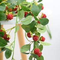 Vente en gros de feuilles vertes artificielles de framboisier pour décorations d'intérieur, accessoires de photographie, présentoirs de cuisine et décorations de table.