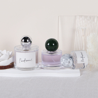 Flacon de parfum en verre de luxe en forme de cylindre vide de 30ml 50ml 100ml avec couvercle à boule