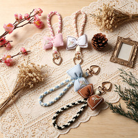 Porte-clés en tissu rembourré de coton avec nœud, style bohème, design brodé, cordon tressé pour téléphone, breloque de sac, cadeau