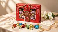 Élégante boîte cadeau en chocolat rouge à motif floral avec nœud, assortiment de gaufrettes fourrées au chocolat doré pour mariages et fêtes